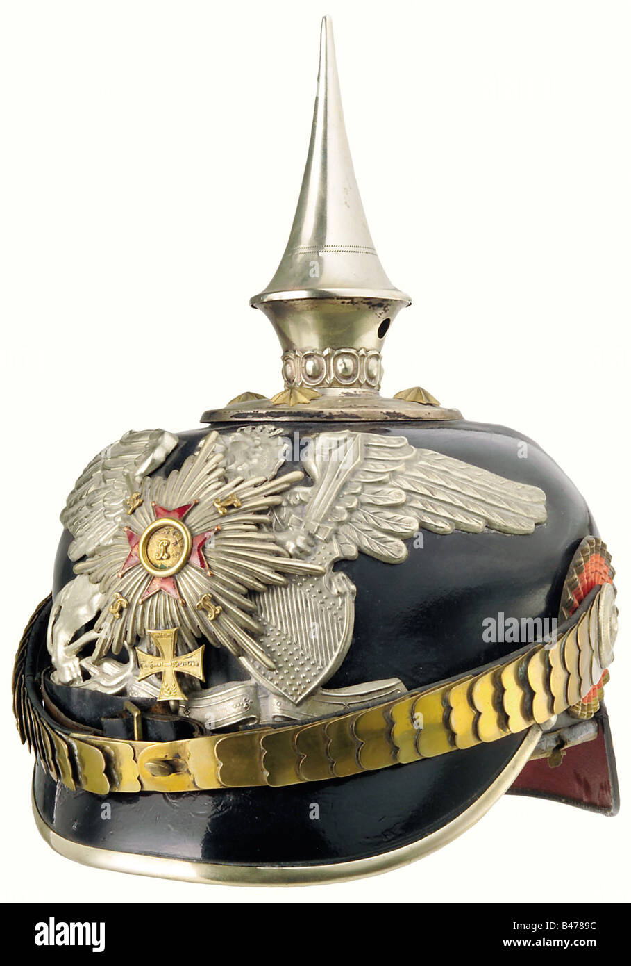 Baden: A helmet for officers, of the 1st Baden Leib Grenadier Regiment No. 109. The leather skull shows minimal crazing, the seam of the rear peak has opened on one side. A tall, unscrewable spike, and a large plate bearing in its centre the star of the House Order of Loyalty, with some damage to the enamel of the left and lower limb of the cross. Flat chinscales attached to officers' style cockades. The liner of ribbed silk is a bit loose and shows traces of wear, as does the sweatband. The size is given on the interior of the skull as 54. Comes complete with , Stock Photo