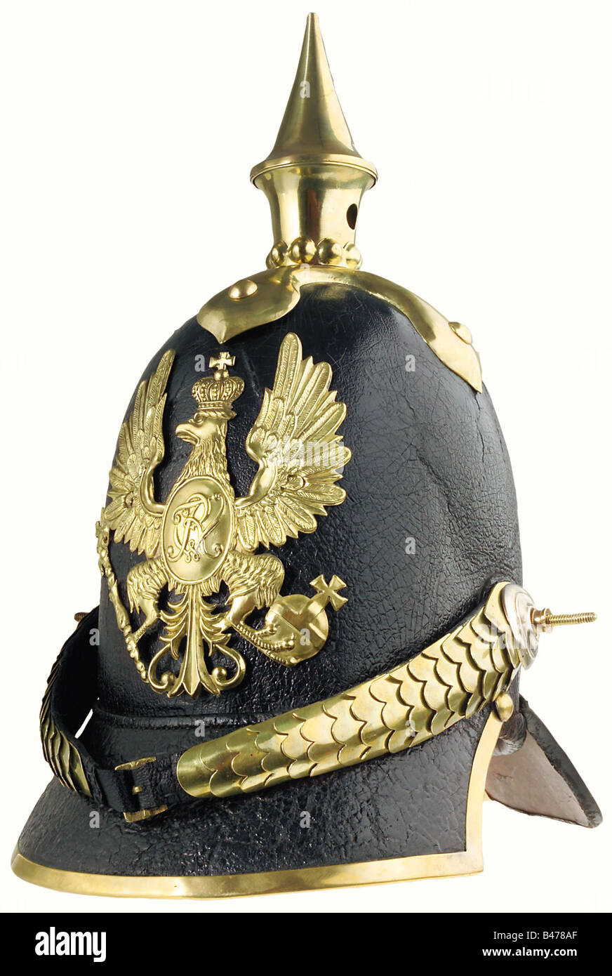 Prussia: A helmet of 1842 pattern for grenadiers., A tall leather skull with a slightly crazed lacquer finish, with mountings of brass. The grenadiers' eagle badge is of the older pattern (two attachment holes were expertly filled in sometime during its active service). Cambered chinscales, secured to an officers' pattern cockade on the right side. The attachment posts are incorrect replacements. The black leather liner shows signs of ageing, but has been expertly restored. Size 56 1/2. A very well preserved helmet of eminent importance for German military hist, Stock Photo