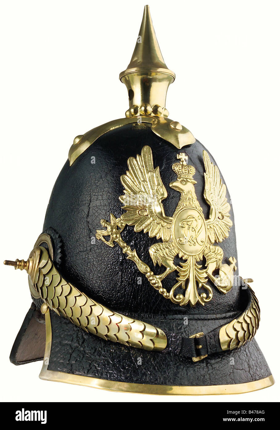 Prussia: A helmet of 1842 pattern for grenadiers., A tall leather skull with a slightly crazed lacquer finish, with mountings of brass. The grenadiers' eagle badge is of the older pattern (two attachment holes were expertly filled in sometime during its active service). Cambered chinscales, secured to an officers' pattern cockade on the right side. The attachment posts are incorrect replacements. The black leather liner shows signs of ageing, but has been expertly restored. Size 56 1/2. A very well preserved helmet of eminent importance for German military hist, Stock Photo
