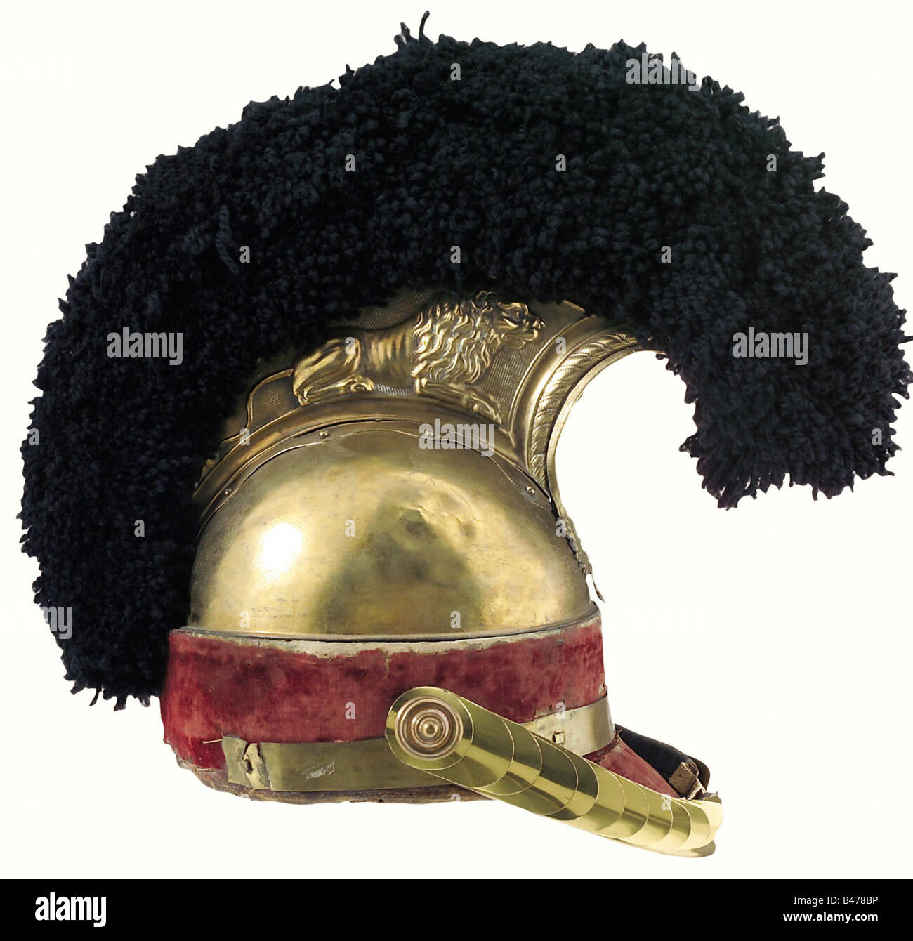 Saxony: A helmet for troopers, of the Leibkürassier guard regiment, 1810 pattern. Comb of pressed brass, with crouching lions on each side. A crowned cypher 'FA' on the frontpiece of the comb. The brass bowl is manufactured in two halves and has some ancient repairs to fissures. The encircling red velvet band is original(?), the leather visor is covered with the same material. There is no neck guard. The rear quarter of the encircling brass band is missing. The crest of black wool, chinscales and plume holder are replacements, the leather lining is original. A , Stock Photo