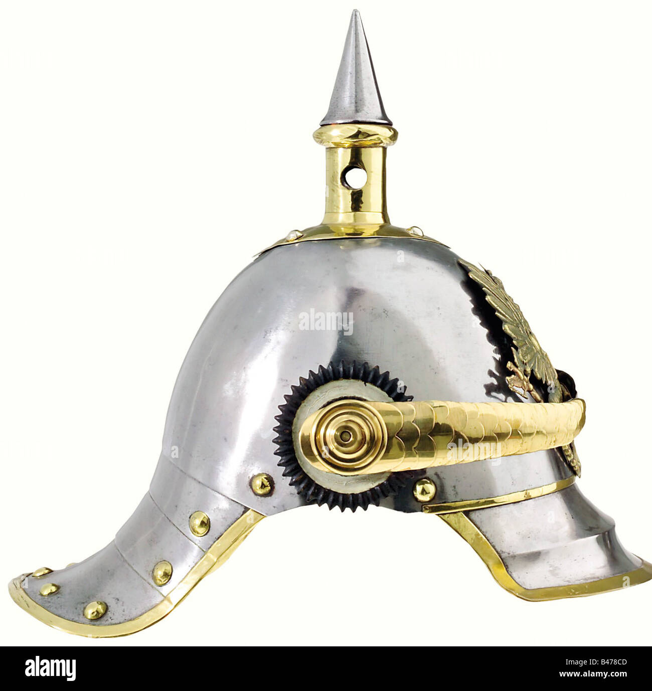 Prussia: A helmet for troopers, of cuirassiers of the line, 1853 pattern. Brass-rimmed steel skull, with slight rust scarring. Some former attachment holes have been filled in by soldering. Brass fittings. The plate is of an older pattern. The cambered chinscales (not original) are attached by long replacement stud bolts. Multiple stamp marks are visible below the left rosette. The leather liner of the visor has some flaws, and the lining of the skull is missing. Approx. size 56. historic, historical, 19th century, object, objects, stills, clipping, clippings, , Stock Photo