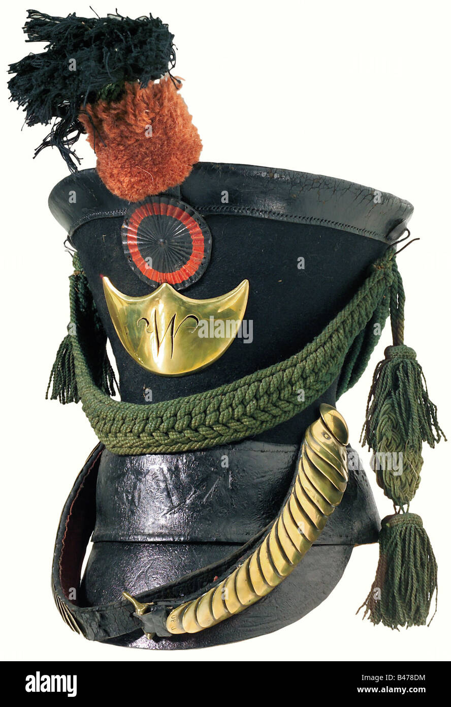 Wuerttemberg: A Jäger shako of 1821 pattern., Body of black felt, with a leather top, a wide lower band and a frontal peak (slightly loosened). Brass plate bearing the cut-out cypher 'W'. A leather cockade sits above this, topped by a pompom of red wool with a black upper part. The cords are green. Cambered chinscales with a stamp mark on each end. Brown leather liner with signs of wear and ageing. Size 54. A rare item, of a type worn until 1849. historic, historical, 19th century, object, objects, stills, clipping, clippings, cut out, cut-out, cut-outs, Stock Photo