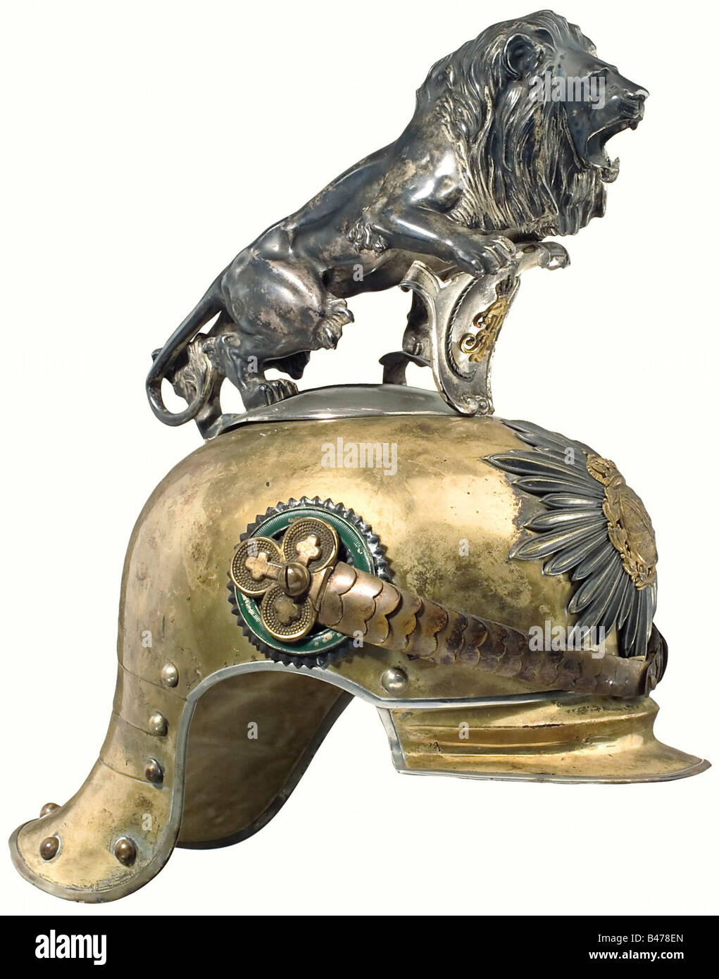 King Friedrich August III, (1865 - 1932). A helmet for an Officer of the Royal Saxon Horse Guard Regiment (1st Heavy Regiment). Gold electroplated tombac helmet skull in a special light version. Silver ceremonial crest in the shape of a lion on a nickel-plated base. Silver-plated star emblem bearing a gold plated coat of arms. Metal chinscales with remnants of gilding on clover leaf shaped rosettes. Officer's cockade. The brim and neck protector are lined with écru coloured velvet. Ribbed silk lining with a somewhat faded monogram, 'F.A.' beneath a crown. Light, Stock Photo