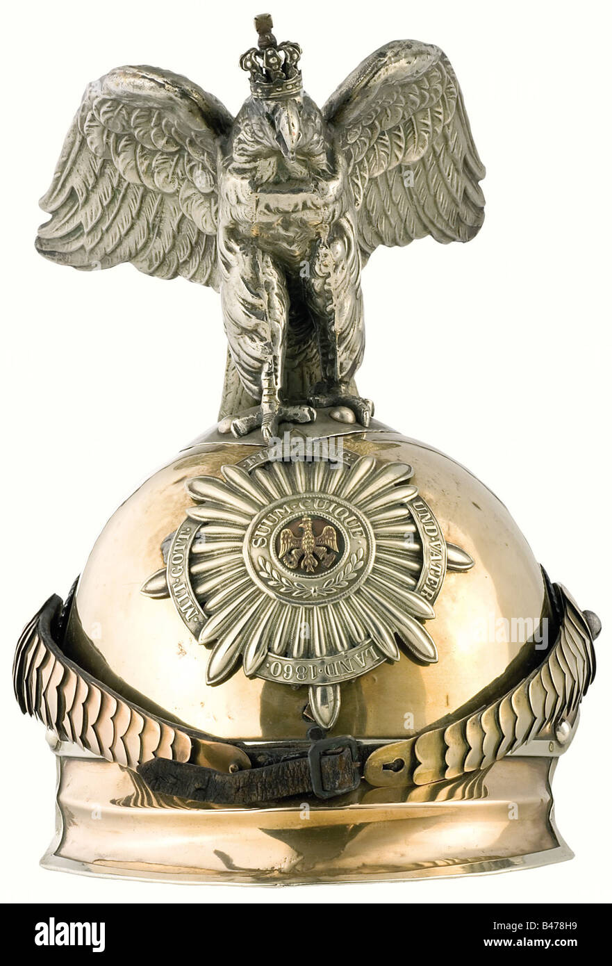 A parade version of the model 1867 helmet, for troopers of the Regiment Garde du Corps or the Cuirassier Guards Regiment. Tombac body with nickel-silver mountings and ball rivets. Nickel-silver star with applied black eagle and a separate fatherland scroll. Convex tombac metal chinscales with screws, small cockades. Parade eagle with silver crown. Leather lining. Numerous holes in the body underneath the plate and the base of the eagle. historic, historical, 19th century, Prussian, Prussia, German, Germany, militaria, military, object, objects, stills, clipping, Stock Photo