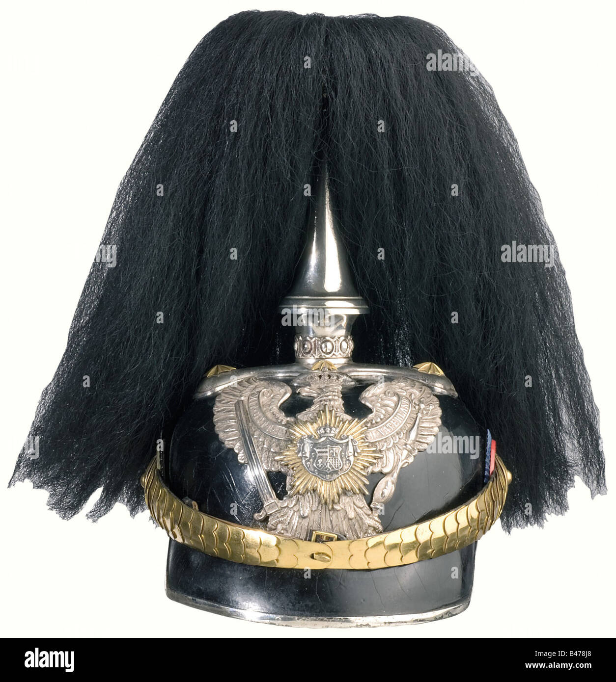 A helmet for officers, of the 19th Dragoon Regiment. Leather skull with silver-plated mountings. Small star, and metal chinscales are gilded. There is a gold-plated star with the silver national coat of arms on the dragoon eagle. Officer's cockades. Conical socket with black buffalo hair plume. Beige, ribbed silk lining. Rare helmet in good condition. historic, historical, 19th century, helmet, helmets, headgear, headgears, protection, protective, uniform, uniforms, utensil, piece of equipment, utensils, outfit, outfits, headpiece, headpieces, object, objects, , Stock Photo