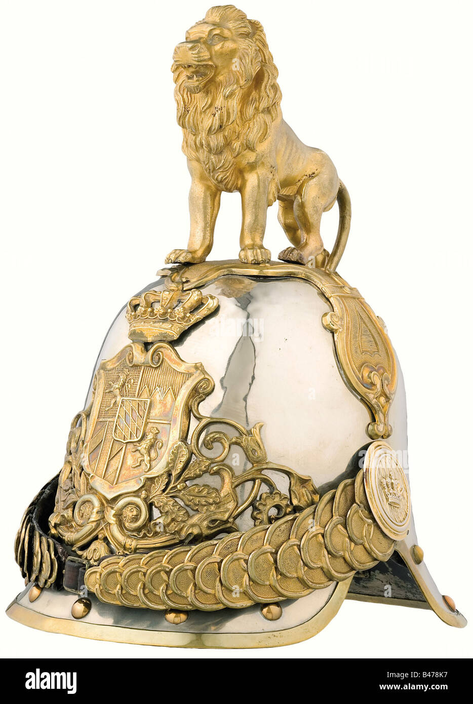 A helmet of 1852 pattern for the Archers Life Guard., In the large parade version with the standing, gold plated lion. Polished nickel-silver skull with fire-gilded tombac fittings, broad metal chinscales on crown rosettes. The lion has the part number '37' on the rear leg. Original leather lining. The part number '48' is soldered into the rear peak. Cracks, visible only from the inside, and a small break in the skull. Rare helmet. historic, historical, 19th century, Bavaria, Bavarian, German, Germany, Southern Germany, the South of Germany, object, objects, st, Stock Photo