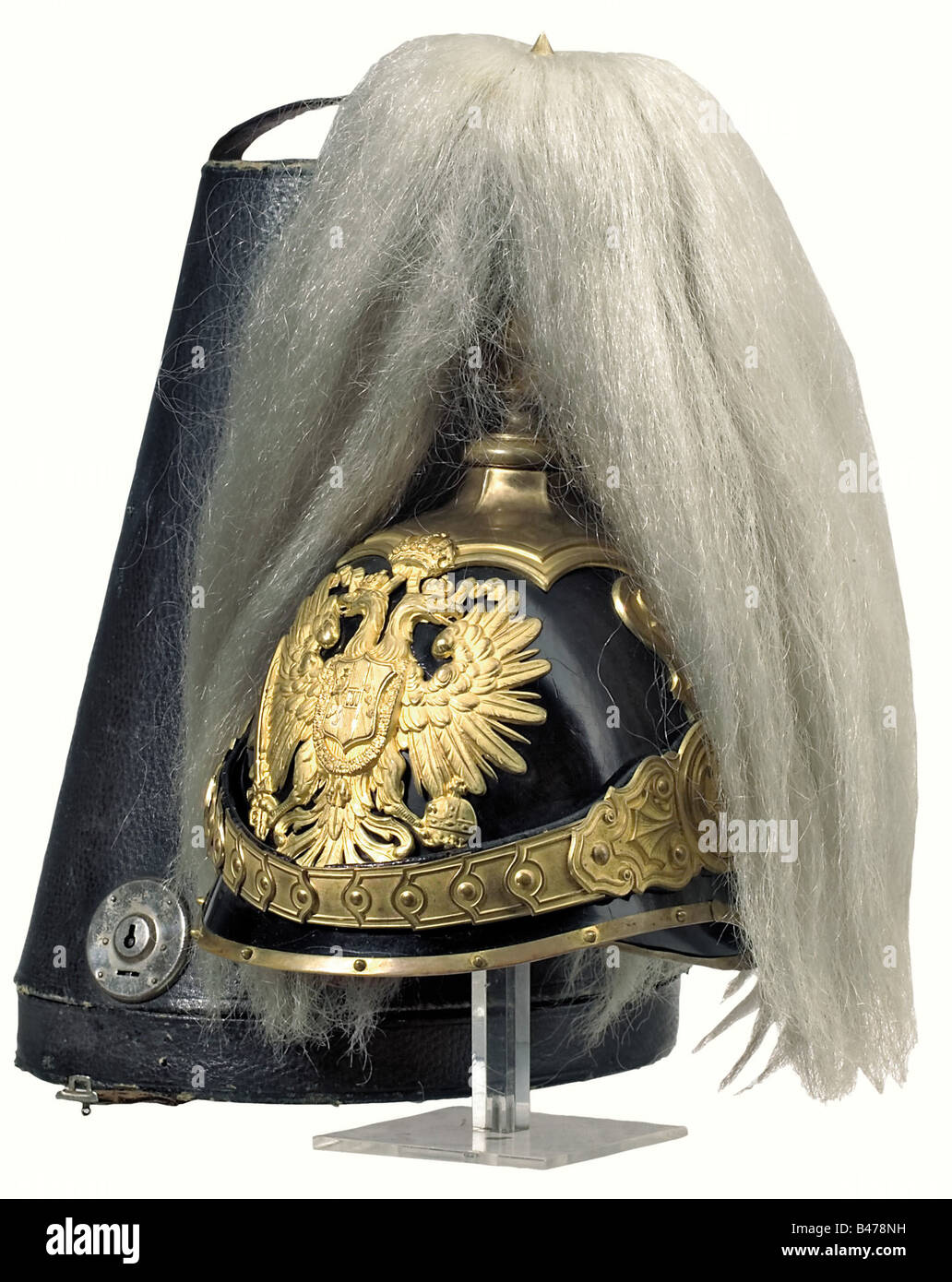 An officer's helmet of the 'Trabanten' Life Guards, according to the regulations of 1904. Tinned and black lacquered steel body. Mountings with frosted and polished gold plating. Leather sweatband, interior silk lining, complete with white buffalo hair crest. It comes with a black leather hat box with chamois tanned leather lining. Extremely rare and desirable helmet in outstanding condition. historic, historical, 1900s, 20th century, Imperial, Austria, Austrian, Danube Monarchy, Empire, object, objects, stills, clipping, clippings, cut out, cut-out, cut-outs, , Stock Photo