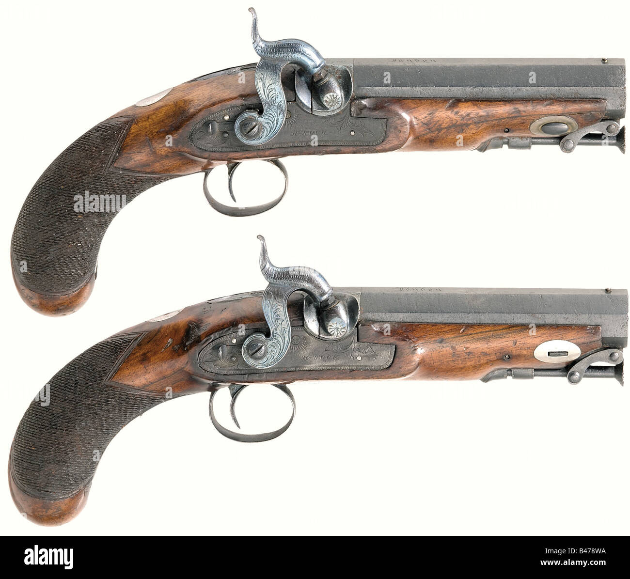 A pair of percussion pistols, Henry Nock, London, circa 1800. Octagonal barrels with smooth bore in 14 mm calibre with patent breechblocks and silver inlays over the chambers. 'London' is engraved on top of the barrels. The sides of each piece are stamped with an Irish registration number above the tower proof mark. Floral engraved converted percussion locks with slide safeties, signed, 'H. Nock.' Walnut full stocks with checkered grips. Engraved trigger guards and captive iron ramrods. Iron parts have light pitting and have been mostly reblued. Length of each , Stock Photo