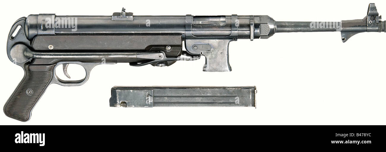 An MP 40. Converted to semi-automatic model 'SLK 38/40', in 9 mm Parabellum calibre. No. 8824. Matching numbers. Bright bore. Later German proof mark. Inscribed, 'MP 40 /bnz 42' (Steyr Factory) on the receiver. WaA acceptance mark. Folding stock. Dark brown Bakelite grip panels and grip piece. Almost complete bluing with a few storage marks. 32-round magazine. There is also a loose aluminum support bar. Comes with the BKA-certificate of conversion. As new condition. Unique. Erwerbsscheinpflichtig. historic, historical, 1930s, 20th century, ordnance weapon, serv, Stock Photo