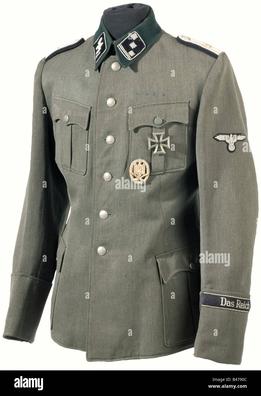 A field tunic for an Obersturmführer, of Combat Engineers. Private purchase piece, of field grey, Italian gabardine with a dark grey collar, sand coloured cotton lining, and field grey buttons. Sewn-on shoulder boards with doubled black backing and silver stars. Silver embroidered sleeve eagle (signs of wear). Silver woven BeVo sleeve band, 'Das Reich' in the flat wire version. The General Assault Badge and the Iron Cross 1st Class are pinned on to the tunic. There is a separate pair of museum-made, proper collar panels with a '1' added in silver embroidery. hi, Stock Photo