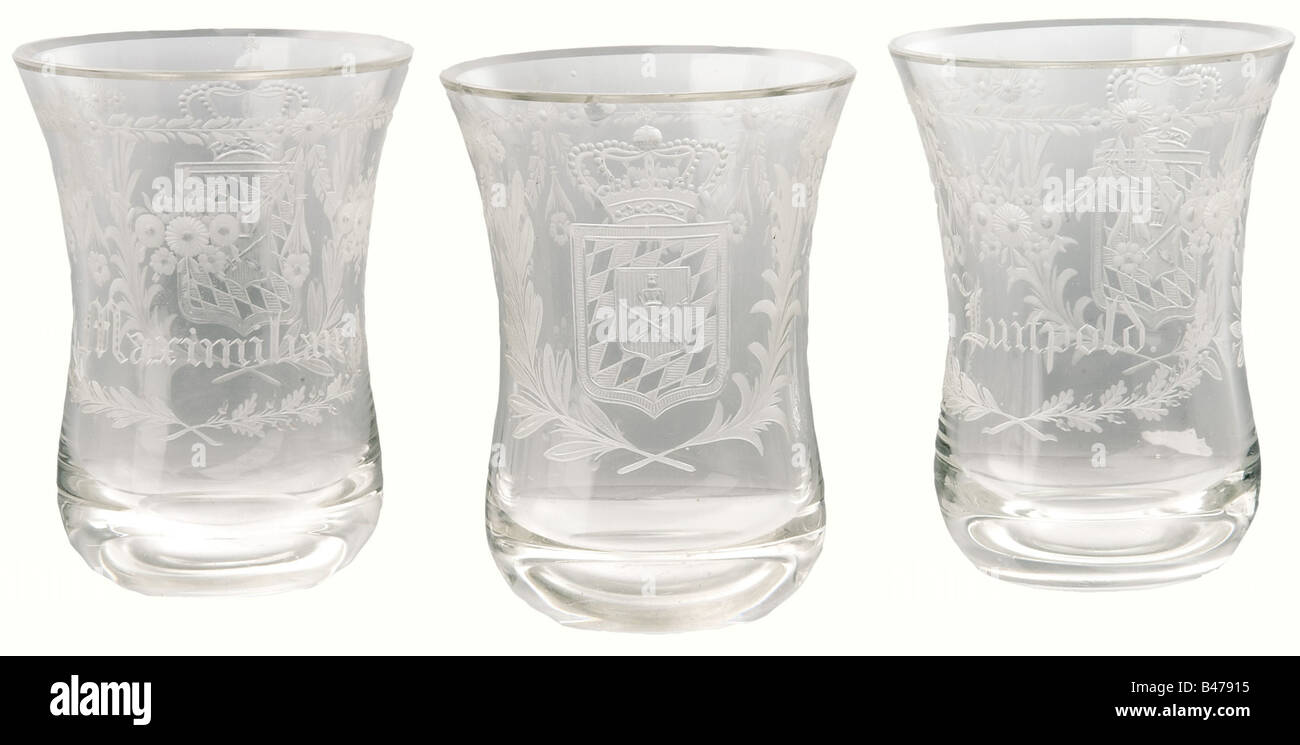 King Ludwig I - ten crystal glasses, belonging to the Royal Family, circa 1835. Beaker shaped, cut with the crowned Bavarian coat of arms inside bound laurel and palm branches, and surrounded garlands of flowers. The reverse sides show the names of the royal pair's children. Complete set except for the missing glass for their daughter Theodolinde. The two beakers for the royal pair, Ludwig and Therese, are without names, the others bear the children's names: Maximilian (King Maximilian II), Mathilde, Otto (King of Greece), Luitpold (Prince Regent), Adelgunde, H, Stock Photo