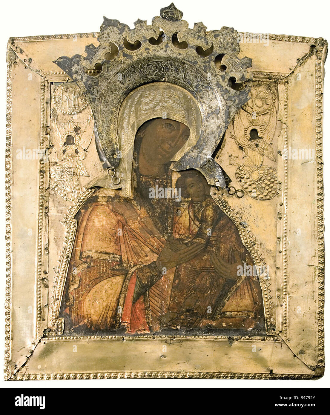 A Russian icon, first third of the 19th century. Egg tempera on wood. Portrayal of the Mother of God with Christ Child. Oclad of fire-gilded copper (partially damaged), fine engraving of the Virgin Mary's crown. On the reverse side a handwritten gift dedication, dated 1831. Size 32 x 27 cm. fine arts, people, 19th century, fine arts, art, painting, paintings, object, objects, stills, clipping, clippings, cut out, cut-out, cut-outs, Artist's Copyright has not to be cleared Stock Photo