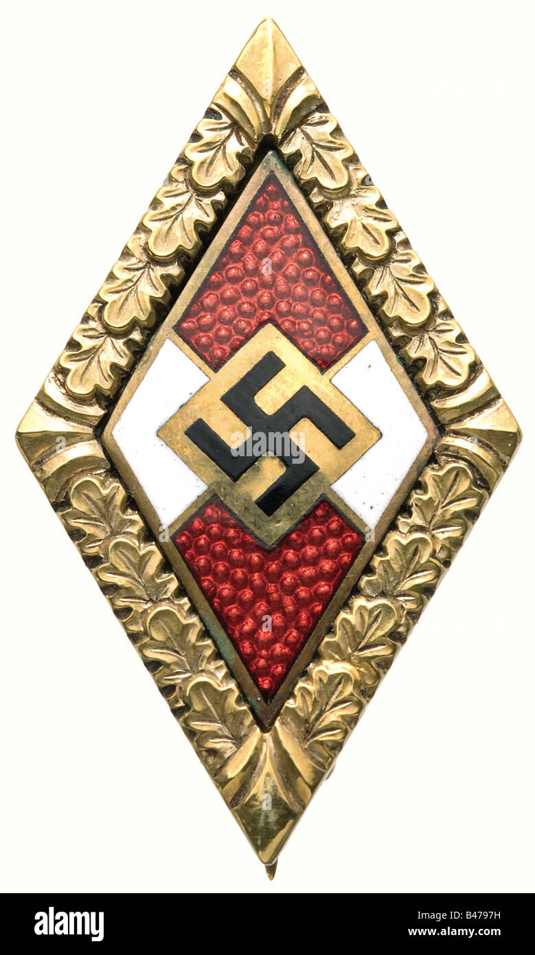 Hanna Reitsch - a Golden Honour Badge of the Hitler Youth with Oakleaves., (OEK 3767). Gold and enamel, polished reverse, mark of fineness '585'. Thin needle, rounded hinge. 35 x 20 mm, 9 g. Undamaged, in excellent condition. Included is a typed Christmas letter of 10 December 1972 (recipient obliterated) with hand-written phrase 'With sincere thoughts of you, Hanna Reitsch', on the back a printed photo of Hanna Reitsch in front of a glider, underneath an excerpt from her book 'Fliegen - mein Leben' (Flying is My Life): 'Those who have met God must be close to , Stock Photo