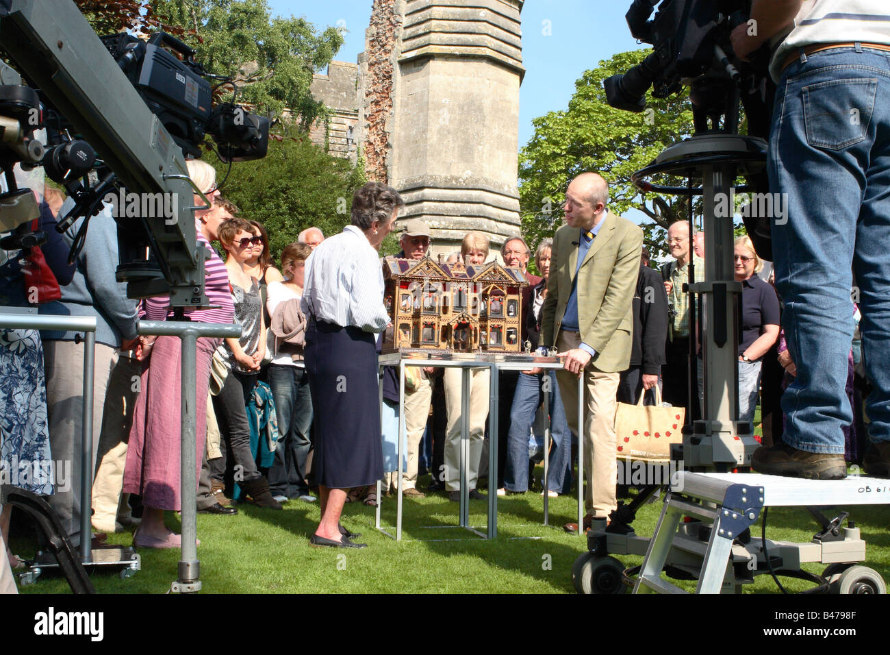 BBC TV The Antiques Roadshow expert and public with film crew filming with an antique dolls house at Wells Somerset Autumn 2008 Stock Photo