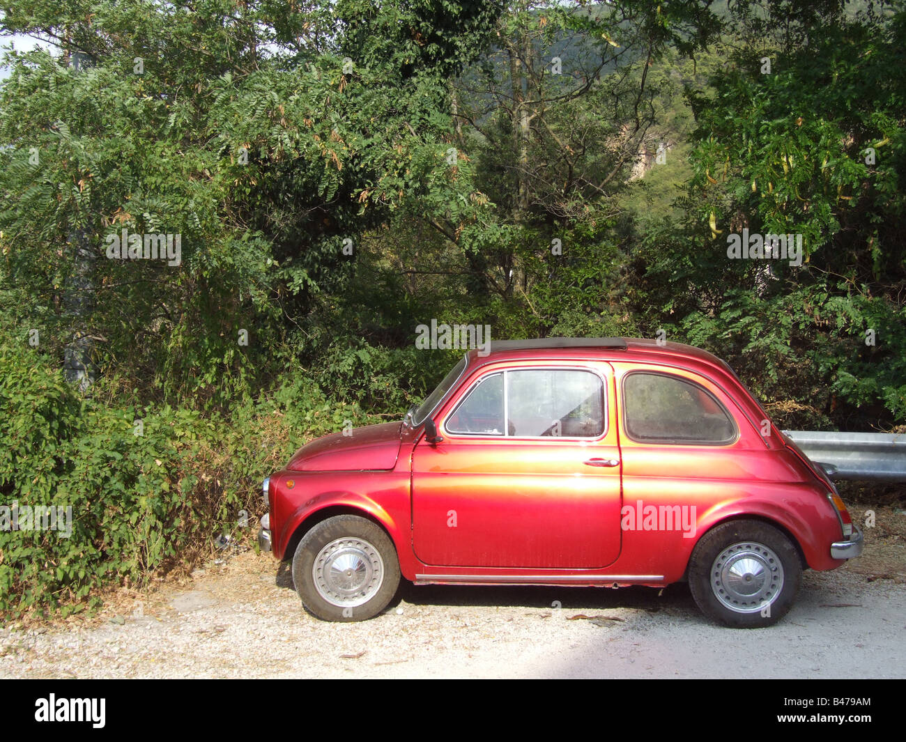 one old red fiat 500 car parked in countryside in italy Stock Photo - Alamy