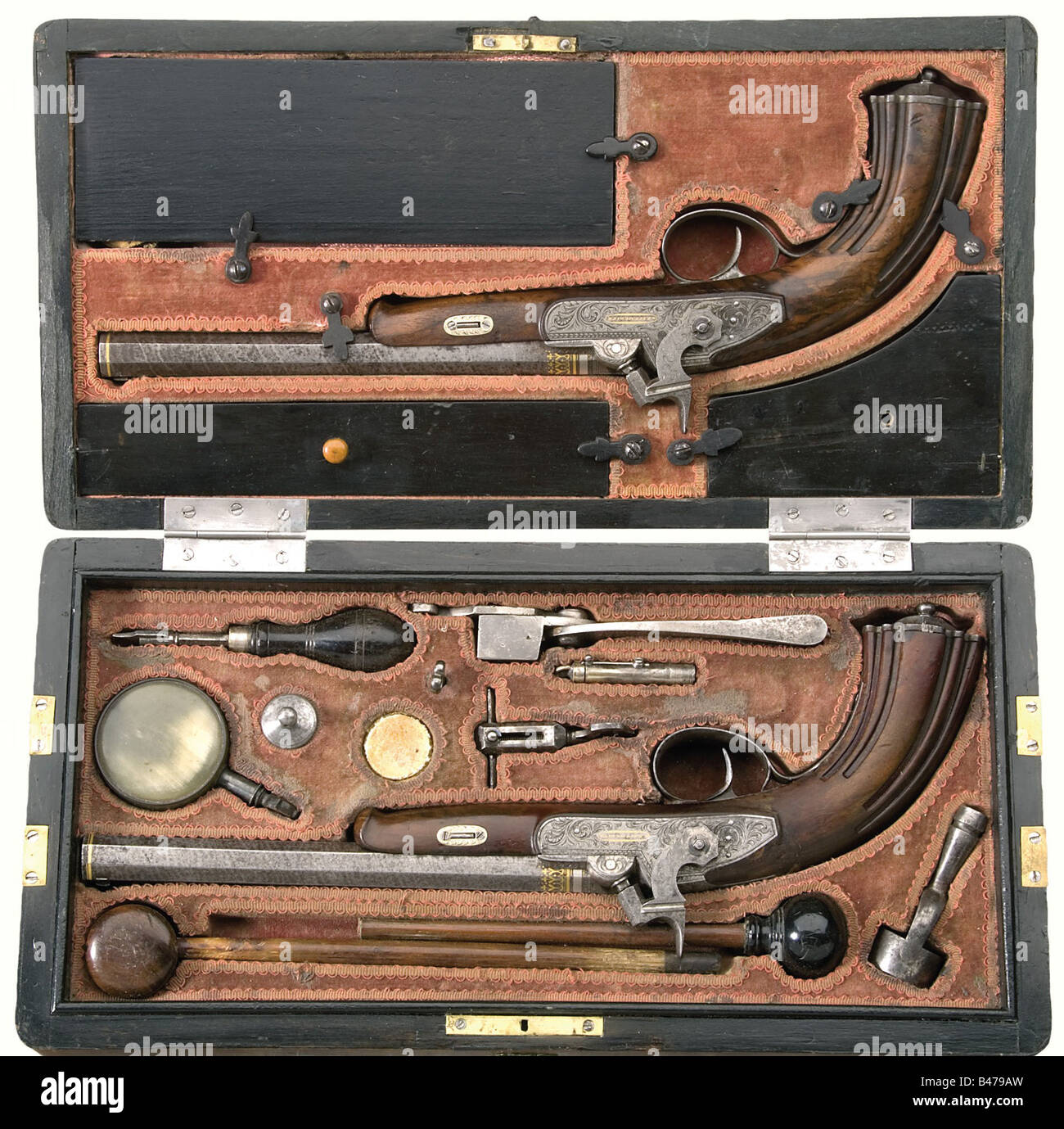 A cased pair of percussion pistols, Matthias Nowotny, Leitmeritz/Bohemia before 1838. Octagonal, slightly swamped Damascus barrels with hook breeches and microgroove rifling in 14 mm calibre. Each has a dovetailed iron front sight and adjustable rear sight with gold bands on the muzzles. The chambers and signature 'Nowotny' have decorative gold inlay and the engraved tangs are inscribed in gold '1' and '2' respectively, and each bears the silver 'VR' monogram beneath a crown. The percussion locks have fine floral engraving and are inscribed 'a Leitmeritz' in go, Stock Photo