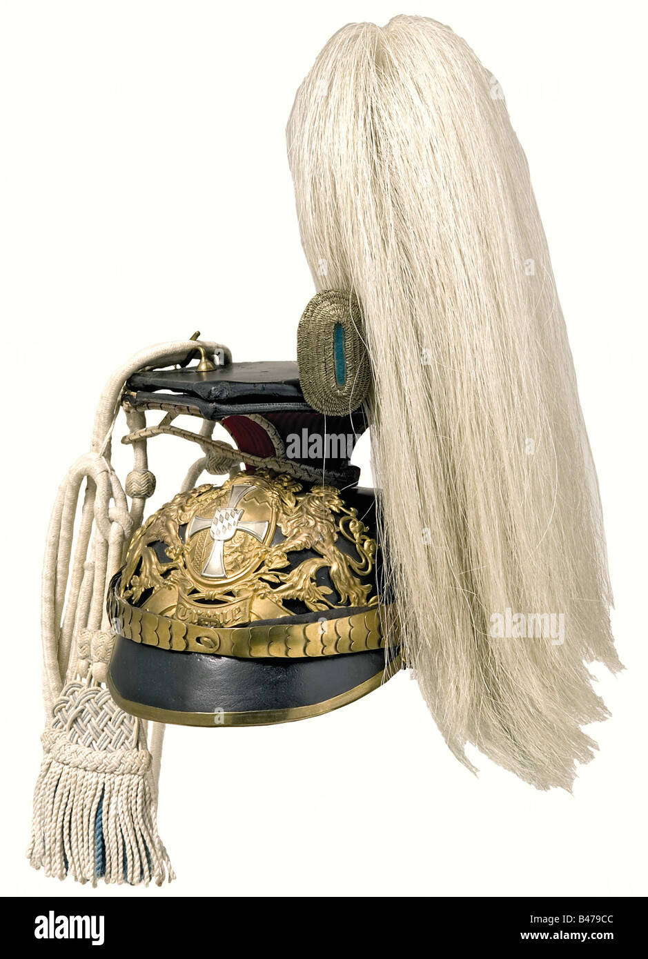 A model 1886 czapka for a reserve Wachtmeister, of the 1st Uhlan Regiment. Leather skull in issue style. Large tombac plate with a nickel-silver reserve cross. Regulation officer field insignia and cockade. Crimson red parade sleeve, white non-commissioned officer's cap lines, white slides with blue interlaces and a white/blue tassel. White horse hair plume with the blue lower part severely bleached. historic, historical, 19th century, Bavaria, Bavarian, German, Germany, Southern Germany, the South of Germany, object, objects, stills, militaria, clipping, cut o, Stock Photo