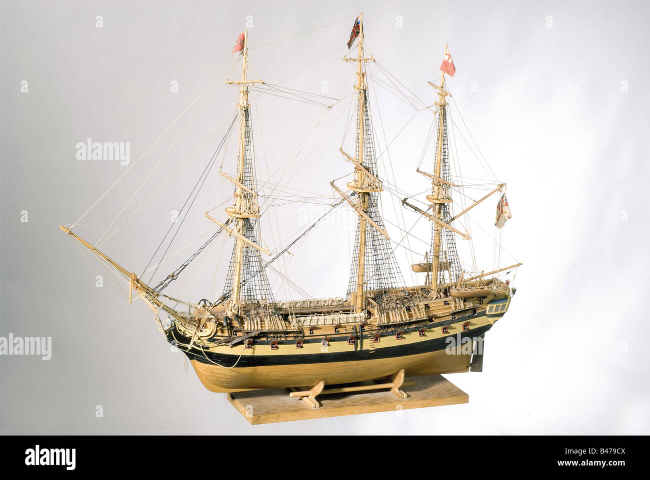 The frigate 'HMS Serapis'., An elaborate, wooden model of a Royal Navy frigate. Fully rigged masts, open gun ports. Stern and rigging painted in colour. Length 100 cm. Width 36 cm. Height 84 cm. The HMS Serapis came off the ways in 1779 as a fifth rate ship of war. On 23 September of that same year, she engaged the weaker 'Bonhomme Richard' under the command of the American Captain, John Paul Jones, in the North Sea. In spite of heavy damage to his ship, Jones refused to strike his colours with the words, 'I have not yet begun to fight', and then boarded and ca, Stock Photo