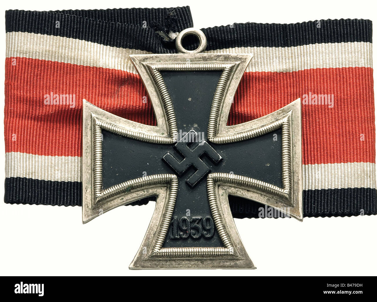 A Knight's Cross of the Iron Cross 1939., Non-magnetic centre with raised  swastika. Silver frame with reverse fineness stamp "800". Weight 27.35 g. A  short ribbon segment is included. Accompanied by a
