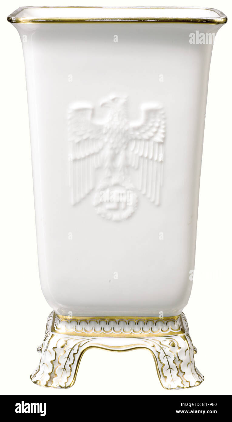 Emil Stürtz (1892 - 1945) - a presentation vase from the Gauleiter of Mark Brandenburg., White glazed porcelain. Tall square shape. The slightly jutting rim and the four feet are decorated with gold ornamentation. There is a party eagle in relief on the obverse side, and the eagle of the Brandenburg coat of arms on the reverse side. The mark of the Sorau Carstens Factory is underglazed in green and gold on the bottom. Height 29.5 cm. Rare presentation gift from the Gauleiter (1936 - 1945), Presiding Chairman (1937 - 1945), and Reichs Defense Commissioner (1942 , Stock Photo