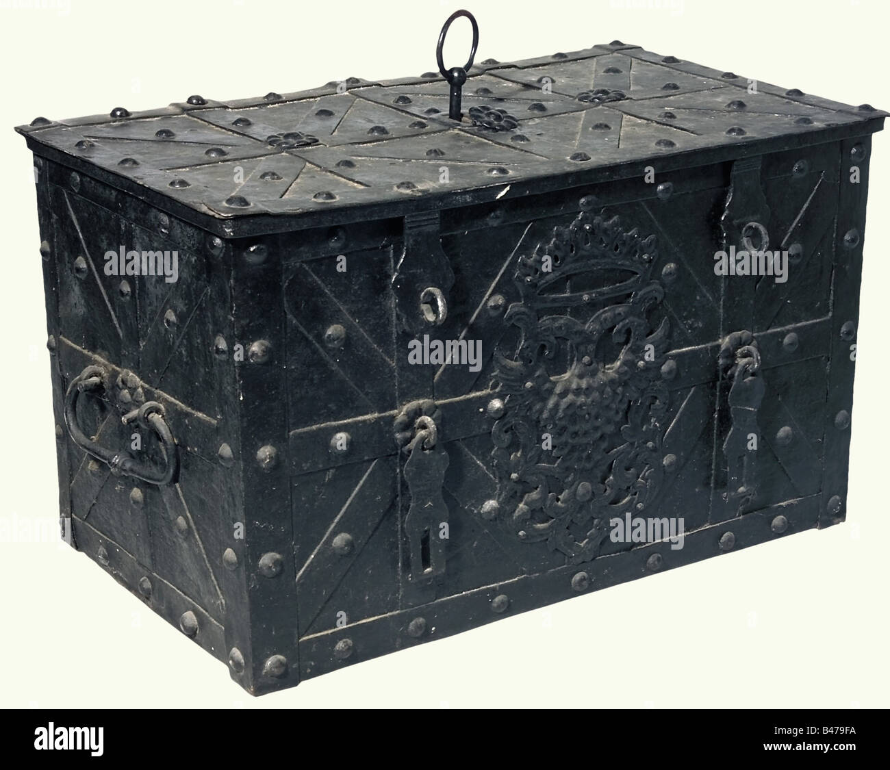 A large German strongbox, 17th/18th century. A rectangular trunk of iron plate furnished with straps and stud rivets. The lid has a central keyhole, a spring loaded lock cover, lock with a hollow shank key and nine wards. The lock mechanism has a simple cover plate. The front bears a decorative double headed eagle, and two hasps for locks. There are two movable carrying handles on the sides. The interior has been recently lined with wood. Dimensions 55 x 91 x 55 cm. historic, historical,, 18th century, 17th century, handicrafts, handcraft, craft, object, object, Stock Photo