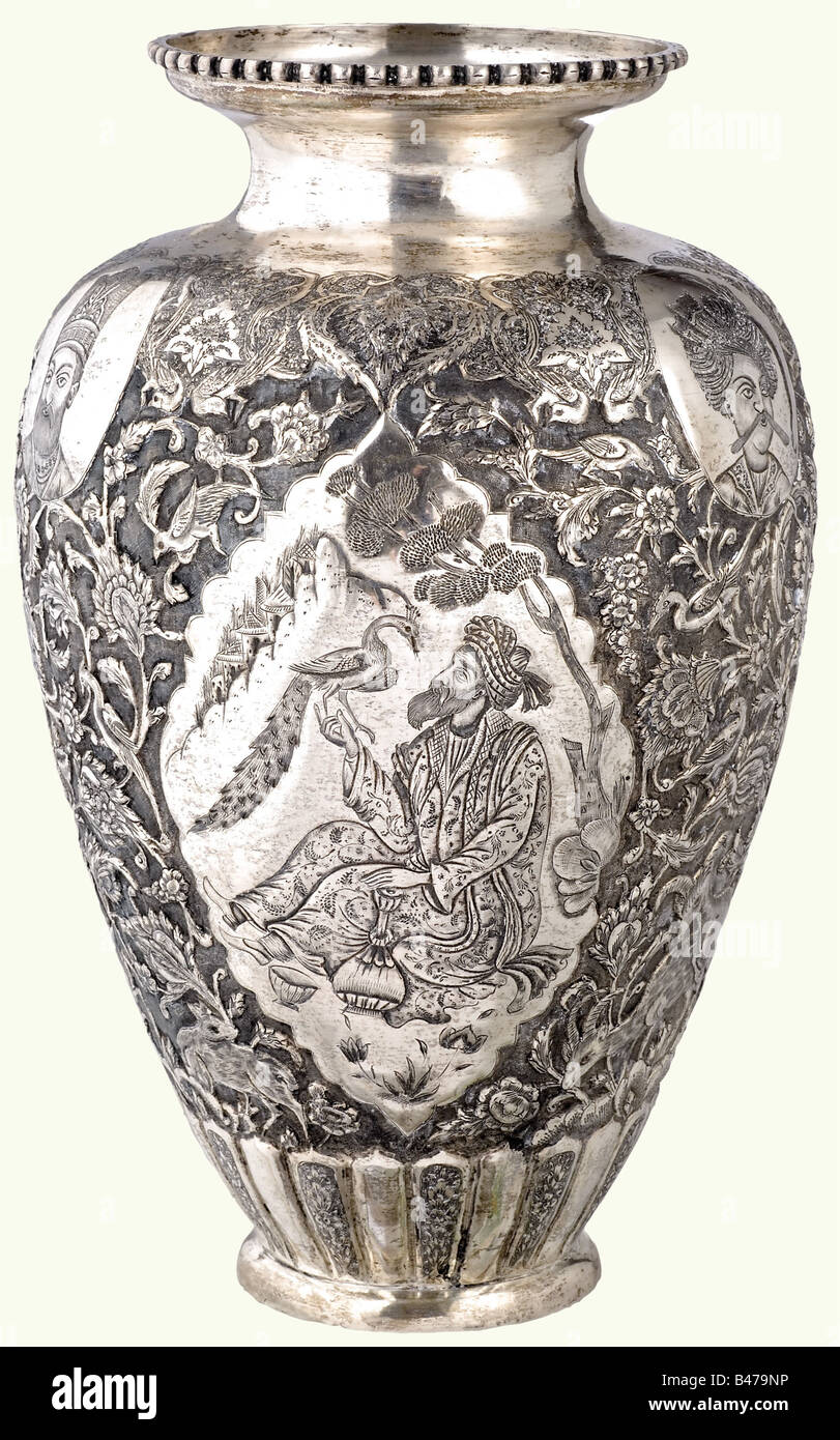 A large Persian silver vase, circa 1930. Bellied shape with sides lavishly  embossed and chiselled on a chased background. There are three portraits of  monarchs on the upper part, and pointed oval
