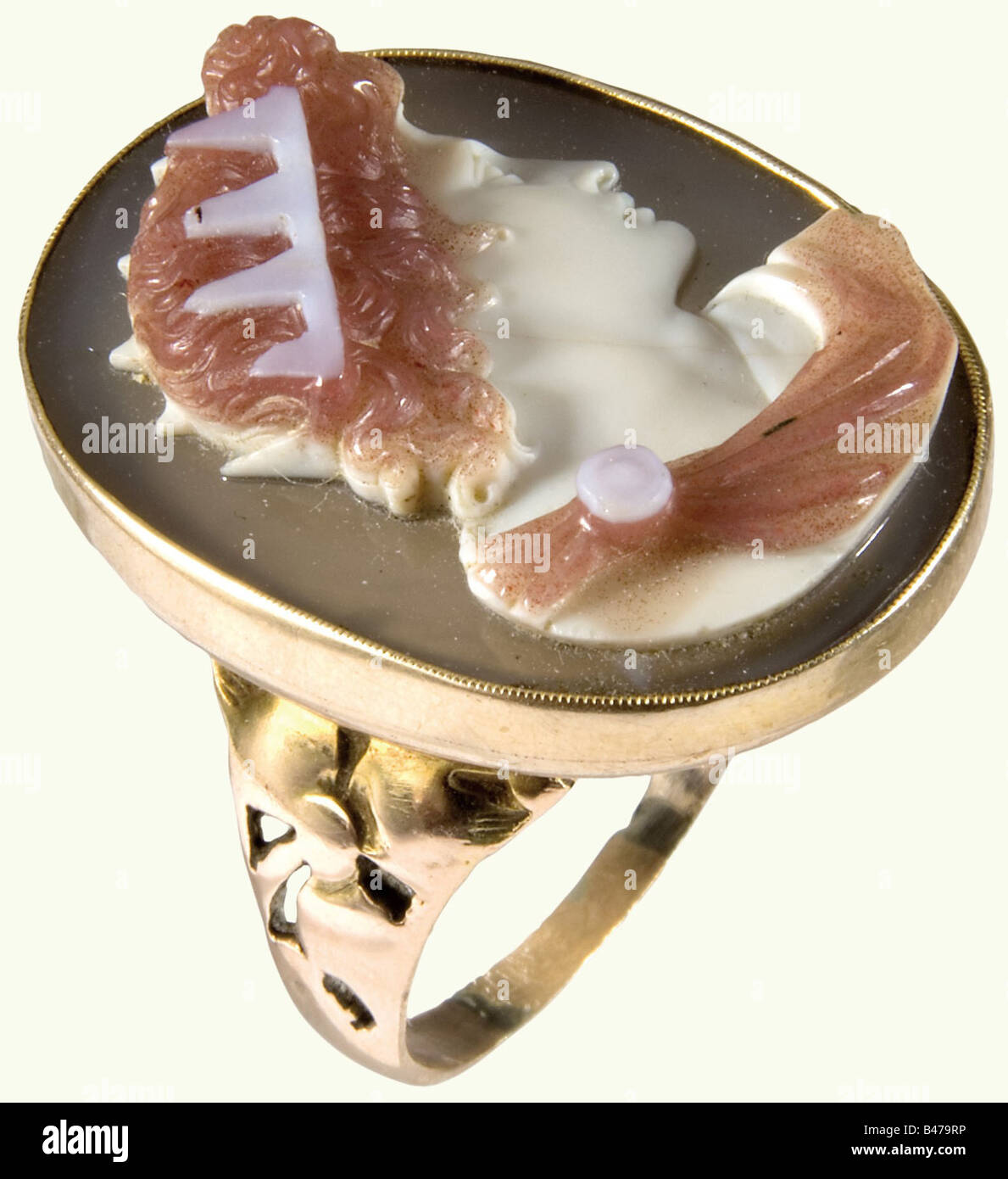 An Italian gold ring with a cameo, 1st quarter of the 19th century. A multi-coloured agate cameo deeply cut with a sculpted antique-style portrait of a monarch. Some of the points of the crown are damaged. Yellow gold setting with openwork floral decoration at the base and a heavy band. Size of the cameo 30 x 23 mm. Ring diameter ca. 22 mm. fine arts, people, 19th century, handicrafts, handcraft, craft, object, objects, stills, clipping, clippings, cut out, cut-out, cut-outs, jewellery, jewelry, noble, precious, Artist's Copyright has not to be cleared Stock Photo