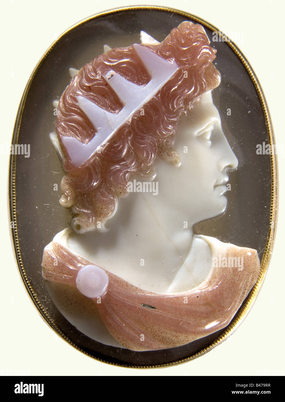 An Italian gold ring with a cameo, 1st quarter of the 19th century. A multi-coloured agate cameo deeply cut with a sculpted antique-style portrait of a monarch. Some of the points of the crown are damaged. Yellow gold setting with openwork floral decoration at the base and a heavy band. Size of the cameo 30 x 23 mm. Ring diameter ca. 22 mm. fine arts, people, 19th century, handicrafts, handcraft, craft, object, objects, stills, clipping, clippings, cut out, cut-out, cut-outs, jewellery, jewelry, noble, precious, Artist's Copyright has not to be cleared Stock Photo