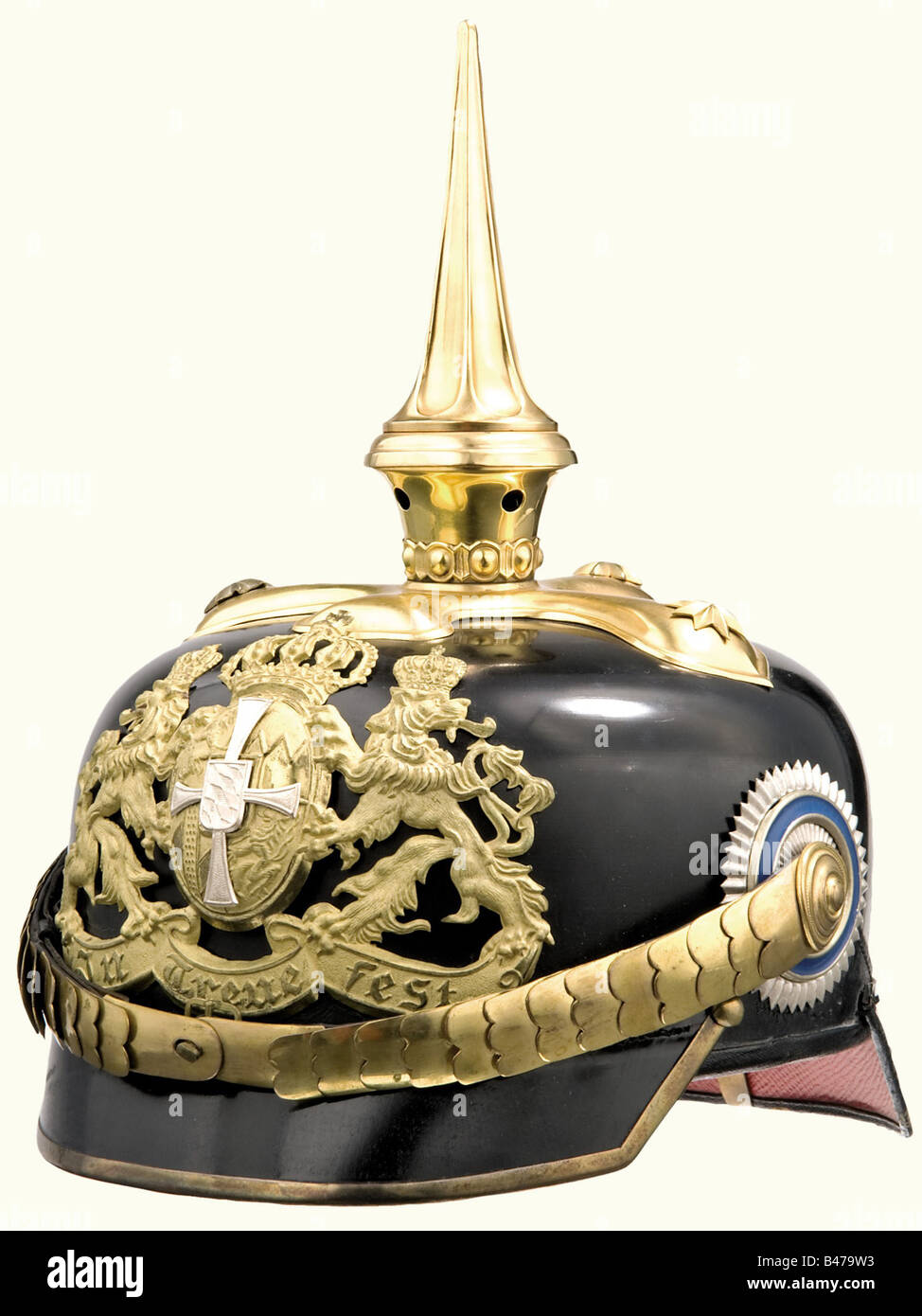 A model 1886/09 helmet for a Reserve Officer, of the Bavarian 2nd Heavy Cavalry Regiment or the 1, 3, 5 and 7 Chevauleger Regiments Black felt bowl with gold plated mountings. Small gilded emblem in the version after 1909 with a silver reserve cross. Screw dismountable spike. Cambered metal chinscales on rosettes. Both cockades. Green sweatband. Clear ribbed silk lining. Size 56. Exterior almost like new. Marks of wear on the inside. Very beautiful, unaltered helmet. historic, historical, 1900s, 20th century, 19th century, Bavaria, Bavarian, German, Germany, So, Stock Photo