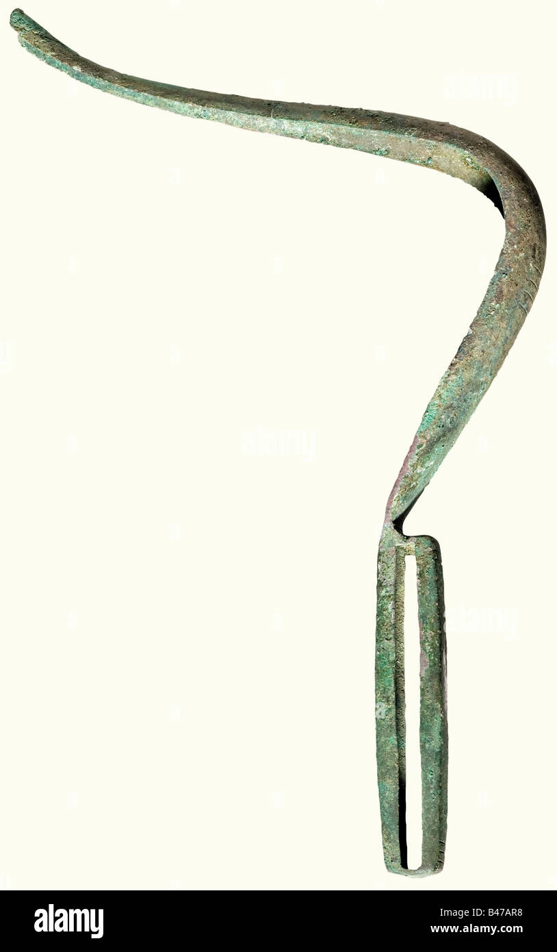 A bronze strigil, Roman, 3rd century A.D. A curved scraper with a hollow grip and finely chased decoration. The point has fingernail ornamentation. Uncleaned excavation discovery with red/green patina, and a small crack on the front part. Length 30.5 cm. Cf. Antiken Museum Berlin 1988, 266 - No. 7. historic, historical, ancient world, ancient world, ancient times, object, objects, stills, clipping, cut out, cut-out, cut-outs, Stock Photo