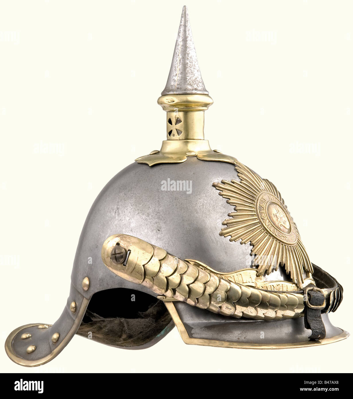A model 1862 helmet for enlisted personnel, of the Garde du Corps Regiment. Steel skull with brass mountings, ridged front peak. Brass fittings. Star of the Order of St. George, with the scroll beneath it reading, 'Peninsula-Garzia Hernandez-Waterloo'. Convex metal chinstraps. Skull has a matt coating of rust. Scroll a replacement. The rosettes for the chinstrap, cockades and lining are missing. Damaged velvet lining for the rear peak. historic, historical, 19th century, helmet, helmets, headgear, headgears, protection, protective, uniform, uniforms, utensil, p, Stock Photo