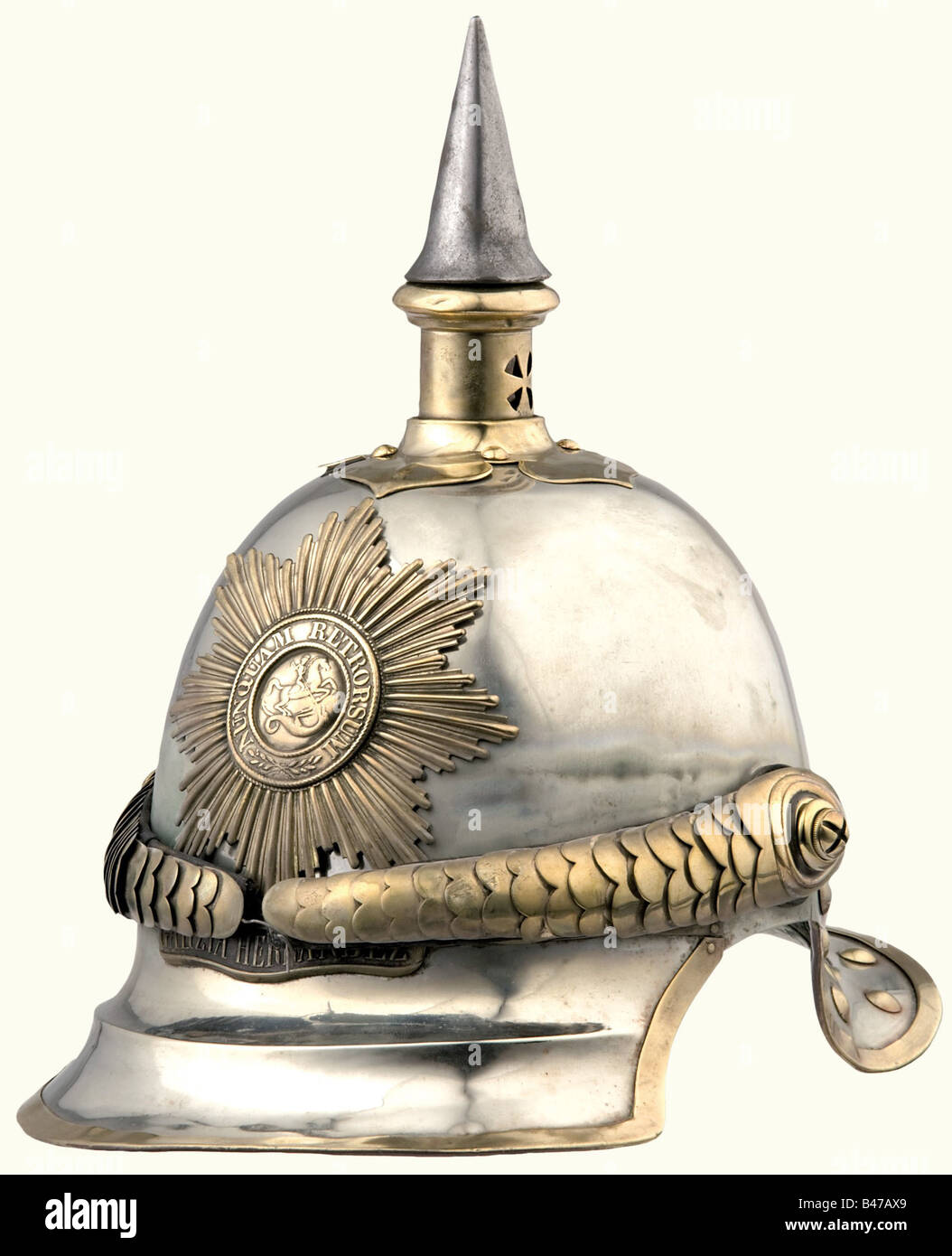 A model 1862 helmet for enlisted personnel, of the Garde du Corps Regiment. A German silver skull with brass mountings. Ridged front peak, brass fittings. Star of the Order of St. George, with the scroll under it reading, 'Peninsula-Garzia Hernandez-Waterloo'. Convex metal chinstrap, on cross slotted screws. Stamped leather cockade. Skull has repaired damage on the back. Lining missing. historic, historical, 19th century, object, objects, stills, clipping, clippings, cut out, cut-out, cut-outs, helmet, helmets, headpiece, headpieces, utensil, piece of equipment, Stock Photo