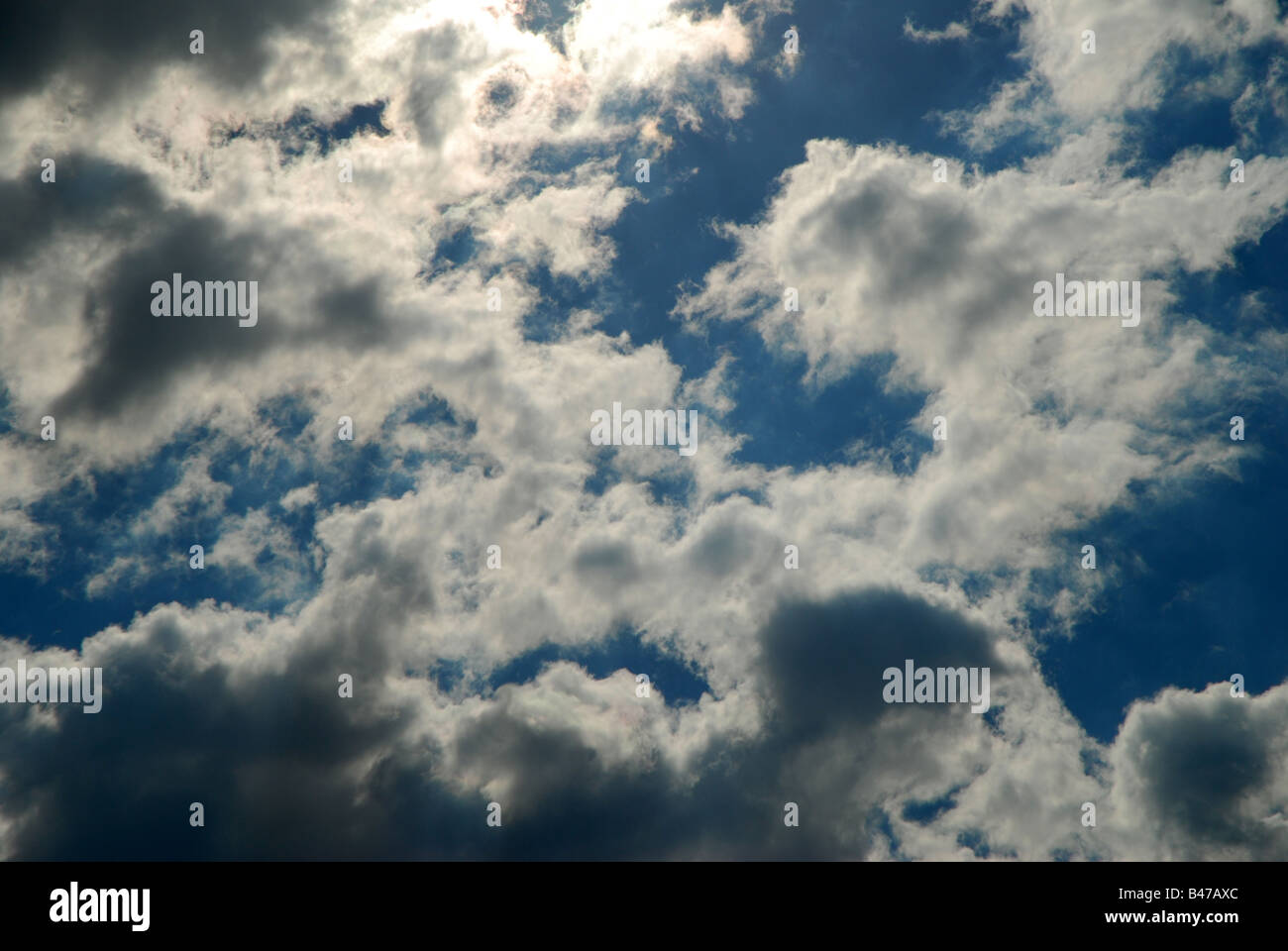 Sun shining through the clouds Stock Photo - Alamy