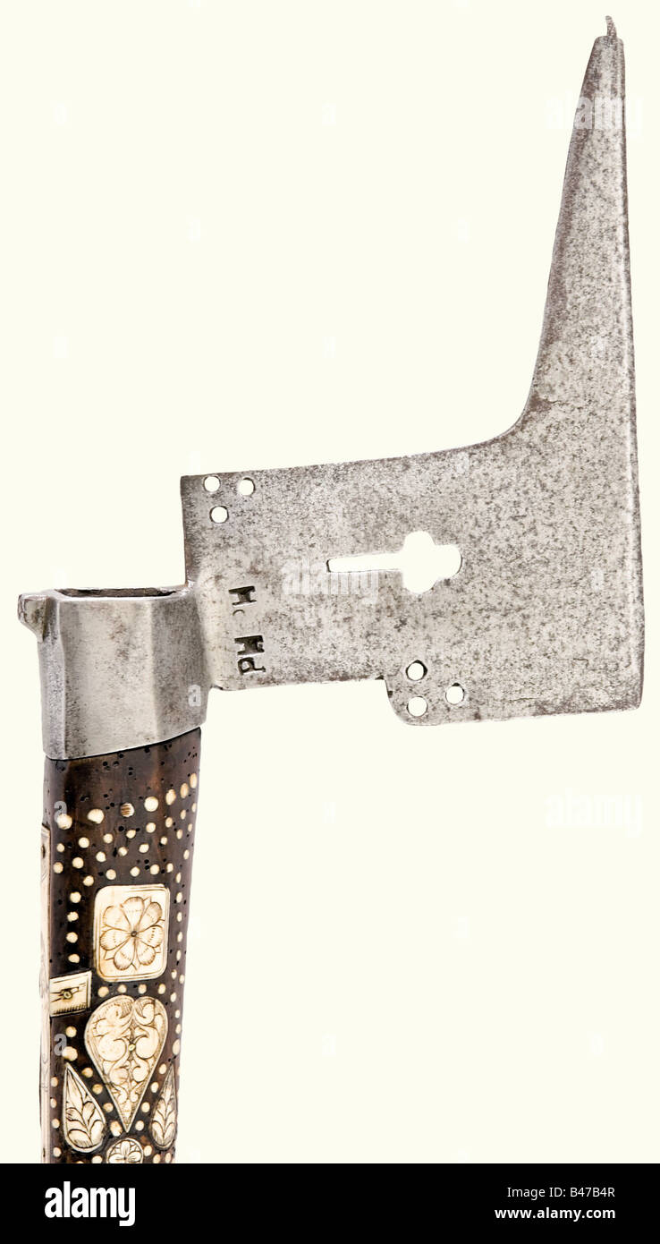 A miner's axe, Saxon Electorate, dated 1687 Iron blade with several perforations, the smith mark 'PH' and a small hammer head on the back. The fruitwood handle (somewhat wormy with a repaired break) is richly inlaid with engraved and blackened staghorn, including cartouches and geometric and floral decoration, with a crucifixion scene on the back. The elector on horseback, a coat of arms and the date '1687' are on the end of the handle. Length 89 cm. historic, historical, 17th century, axe, ax, axes, ax, tool, tools, military, militaria, fighting device, object, Stock Photo