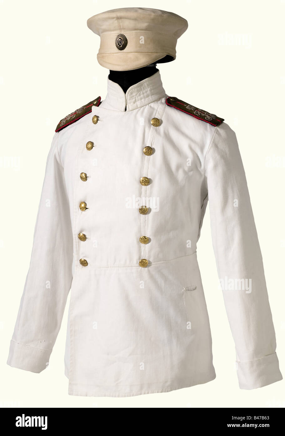 A summer service cap for an officer, Russia, in the style worn ca. 1870 - 1907. Service cap of white linen material, laquered cockade and a small leather visor. Beige lining with traces of wear and a brown leather sweatband. Collector replica of a summer jacket made of white linen material with two rows of original, gilded buttons. Broad, slip-on shoulder boards with later added cipher 'N II' and backing. Size L. historic, historical, 1900s, 20th century, 19th century, uniform, uniforms, clothes, outfit, outfits, textile, object, objects, stills, clipping, clip, Stock Photo