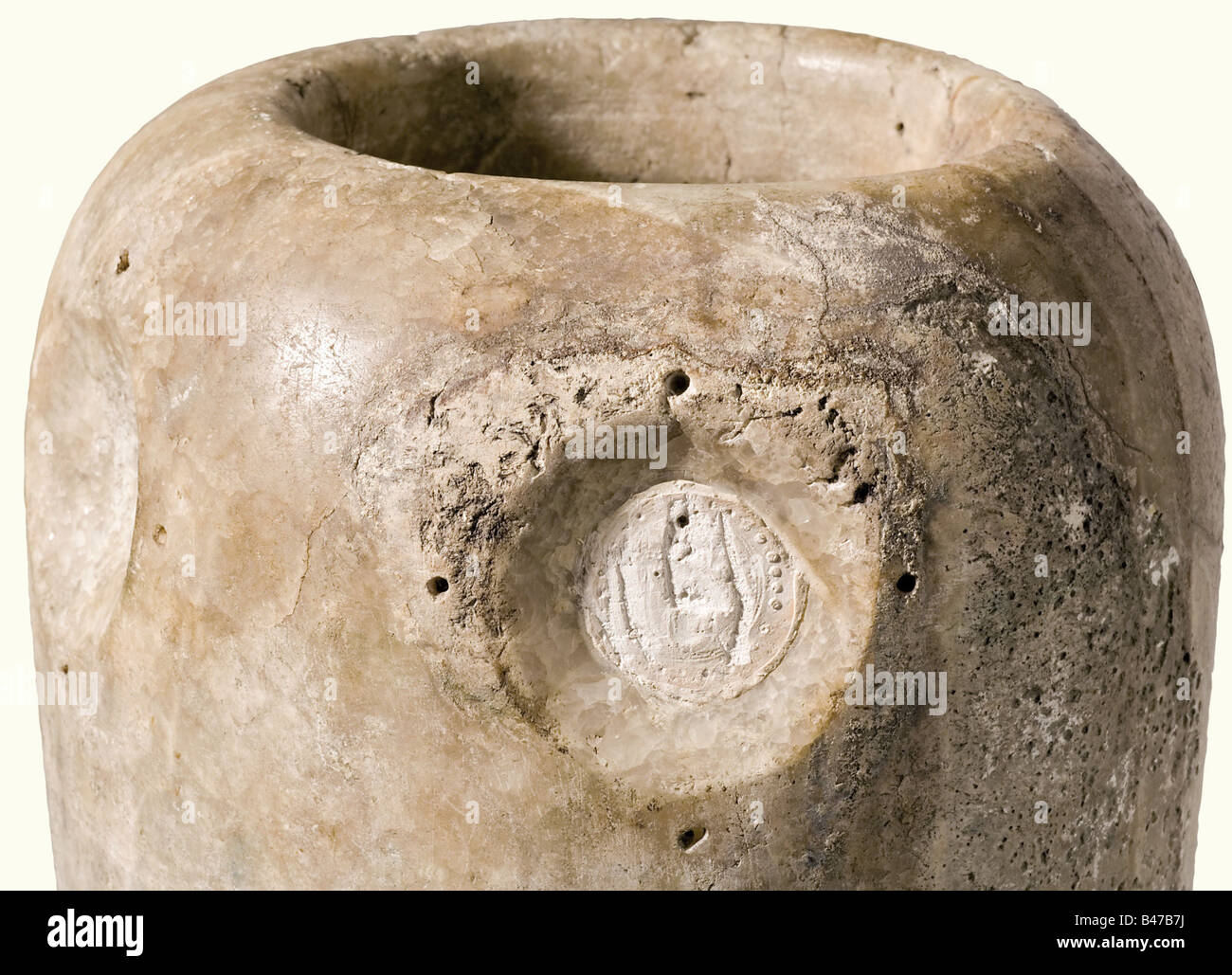 An alabaster canopic jar, Egypt, Middle Kingdom 2040 - 1782 B.C. The light grey alabaster body of the jar is slightly conical. There are three round depressions on the obverse side, and remnants of a gypsum(?) seal on the upper right. Small break on the lower rim. Height 37 cm. historic, historical, ancient world, ancient world, ancient times, object, objects, stills, clipping, cut out, cut-out, cut-outs, vessel, vessels, Stock Photo