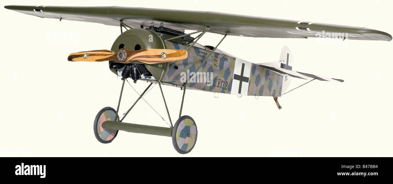 An exceptional flying scale model, of Fokker D VIII, serial no. '132' With full flying control surfaces, the pilot's cockpit fitted with seat, restraining straps, rudder bar and control column, with working trim quadrant and compass, the upper fuselage fitted with a pair of dummy machine guns and fuel gauge, with twin cylinder petrol engine and scale laminated maple and mahogany two-blade propeller by AXIAL of Berlin, the engine concealed behind a dummy riveted metal cowl Incorporating scale cable fastening for the original 110 h.p. Oberursel U.11 nine-cylinder, Stock Photo