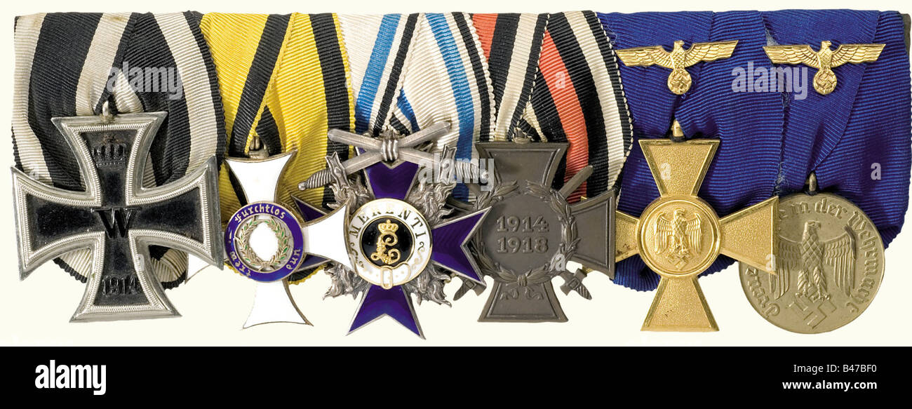 Major General Friedrich Z., a large 6-piece orders clasp Iron Cross 2nd Class of 1914 (OEK 1909). Württemberg, Military Order of Merit, Knight's Cross 1914 - 1918, silver, gilt and enamelled (OEK 2967), Bavaria, Military Order of Merit, 4th Class Cross with Swords, silver, enamelled (OEK 410). Honour Cross for Front Fighters (OEK 3801). Service Awards of the Wehrmacht, 1st Class Cross for 25 years and 3rd Class Medal for 12 years, each gilt with gilt metal Wehrmacht eagles on the ribbons (OEK 3852/54). A beautiful, colour-fresh orders clasp. historic, historica, Stock Photo