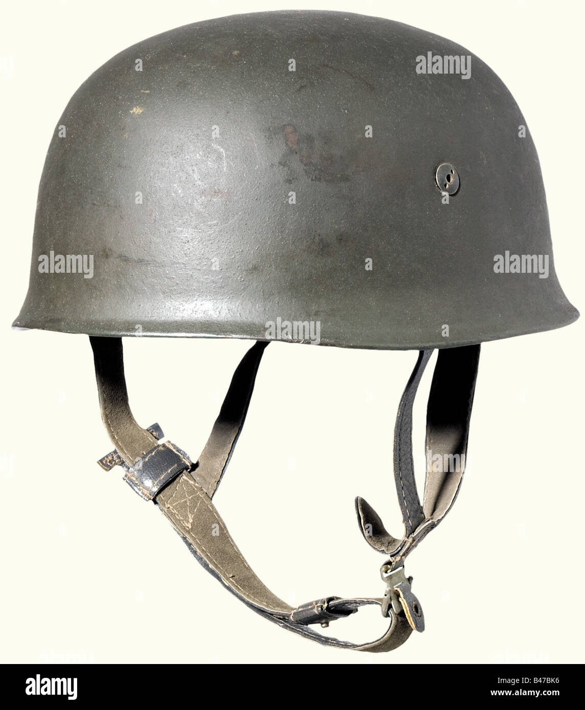 A steel helmet for paratroopers, 2nd model Rough, light blue/grey lacquer. Stamped on the inside. Aluminum inner ring with rubber cushioning. Grey blue leather straps and natural leather lining attached with four screws (two different versions). Stamped inside, 'Baumuster: Heisler Berlin 2', 'Hersteller: F.W. Müller Jr.', 'Kopfweite: Gr. 59' and 'Stahlhelm: Gr. 71'. (Production Model: Heisler Berlin 2', 'Made by: F.W. Müller Jr.', 'Head Size: 59' and 'Steel Helmet: Size 71'). Very good, nearly unworn condition. historic, historical, 1930s, 1930s, 20th century, , Stock Photo