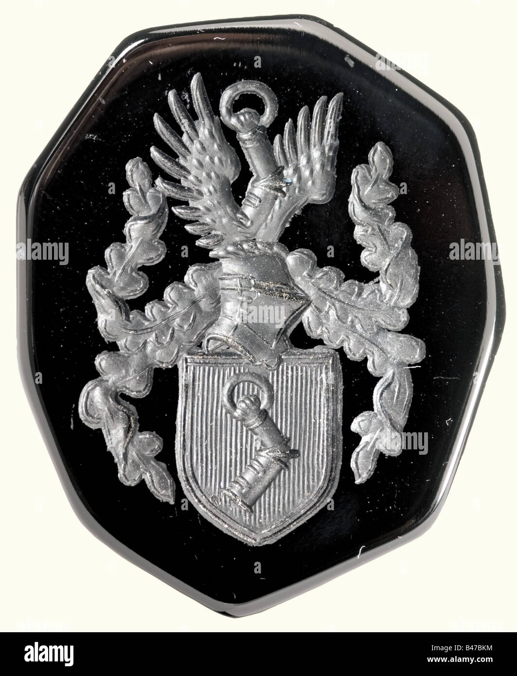 Hermann Göring, an onyx seal bearing his coat of arms The seal is in the shape of the armoured arm from Göring's coat of arms, the ring is silver with the hallmark '800' next to the crown and crescent moon. Göring's helmeted coat of arms is very beautifully cut into the surface of the seal. Total height 106 mm. There is also confirmation from Göring's favorite goldsmith, Prof. Herbert Zeitner, that the seal was made in the W. Brendel factory in Berlin from a design by Hermann Göring and Mr. Rothemund. Rupert Kohlrus did the polishing and cutting there and the M, Stock Photo