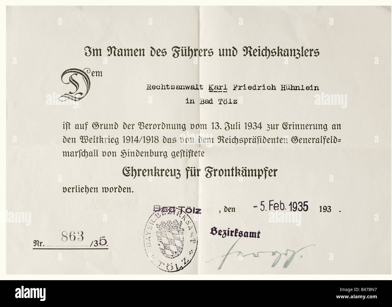 Ehrenzeichen vom 8./9. November 1923 (Blood Order), award document, 1st type, 1933 Monochrome printed, single-sided award certificate on thin, yellowish cardboard, 22.2 x 31.7 cm, at the top is a photographic depiction of the medal awarded to Karl Hühnlein (registration number 407), dated November 1933, facsimile signature of Hitler in lower portion. Small warp, traces of glue from a former mounting. Included is an award certificate for the Cross of Honour for Front Fighters, 1935. Karl Hühnlein (b. 10 May 1900), nephew of the NSKK leader Adolf Hühnlein, was a , Stock Photo