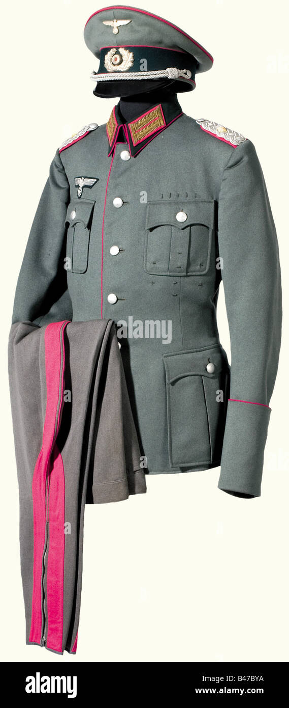 A 'walking-out' uniform for a Lt. Colonel, in Army Headquarters A service cap 'Erel Sonderklasse Extra' with a ventilated cockade. Crimson piping, complete with all insignia. Decorated field tunic with dark green collar, crimson piping, sewn-on shoulder boards and collar patches with gold special embroidery. The tailor's label has been removed. In addition, stone grey breeches with broad crimson leg stripes. Fine quality cloth. Barely worn. historic, historical, 1930s, 1930s, 20th century, army, armies, armed forces, military, militaria, object, objects, stills, Stock Photo