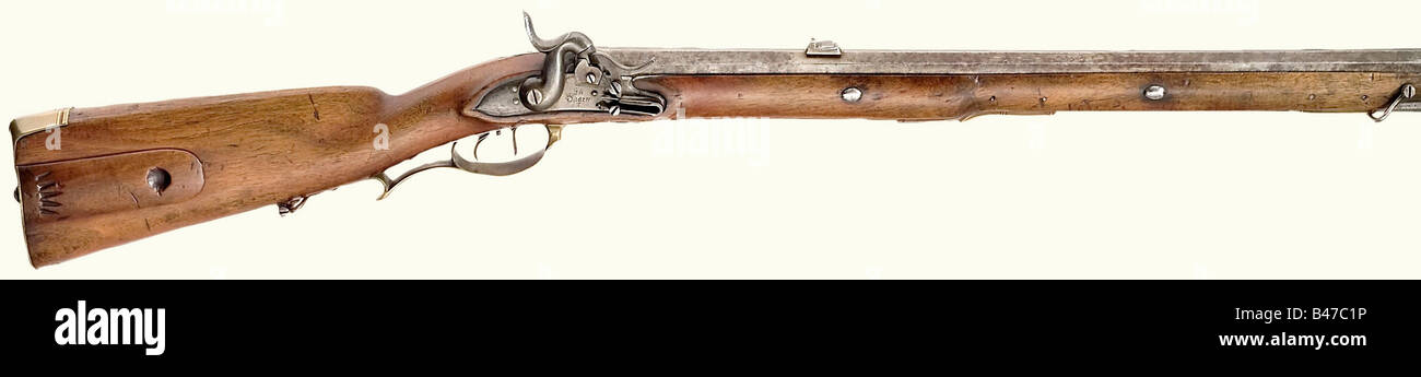 A model 1810/35 Jäger rifle., Octagonal barrel with seven groove rifling in 15 mm calibre. Dovetailed fixed rear sight with two folding leaves. Converted lock with a hinged nipple protector. Lock plate has the maker's mark, 'Saarn' as well as 'FW'. Set trigger. Walnut stock with brass furniture, and patch box. Bayonet mounting on the side removed by a military armorer. Iron ramrod with brass jag. Length 105 cm. Extremely rare. Only 1113 rifles were made in Saarn between 1810 and 1835. historic, historical, 19th century, Prussian, Prussia, German, Germany, milit, Stock Photo