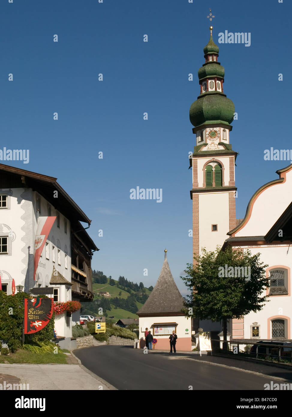 Village church and the Kellerwirt hotel once a 12th Century monastry in Oberau Austria Stock Photo