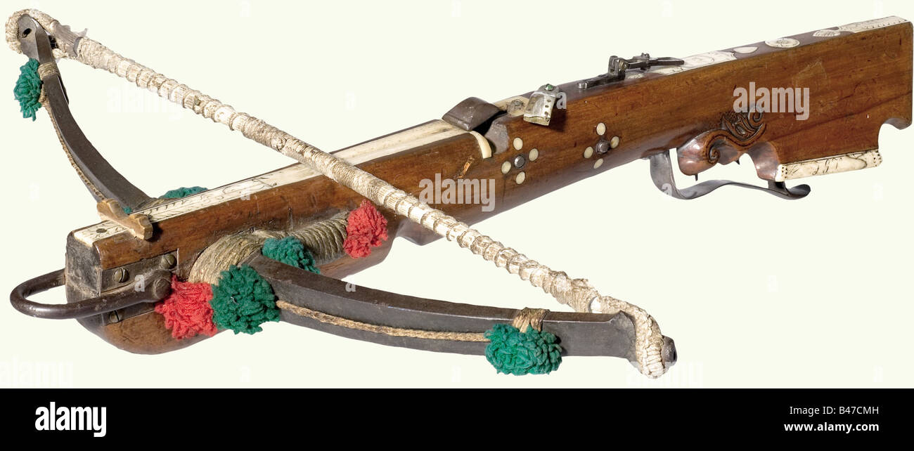 A German hunting/sporting crossbow, circa 1750. Heavy iron prod with the original twisted hemp string and tassels of green and red wool. The cherry wood tiller has bone inlays, some engraved. Inserted wooden bolt groove, iron nut. Double axel lock. Double set trigger. The horn bolt retainer is damaged. Folding sights. The inscription 'No. 15' is engraved on top, and the monogram 'FGK' on the lower edge of the cheek piece. Length 78 cm. historic, historical, 18th century, crossbow, crossbows, distance weapon, weapons, object, objects, clipping, cut out, cut-out,, Stock Photo