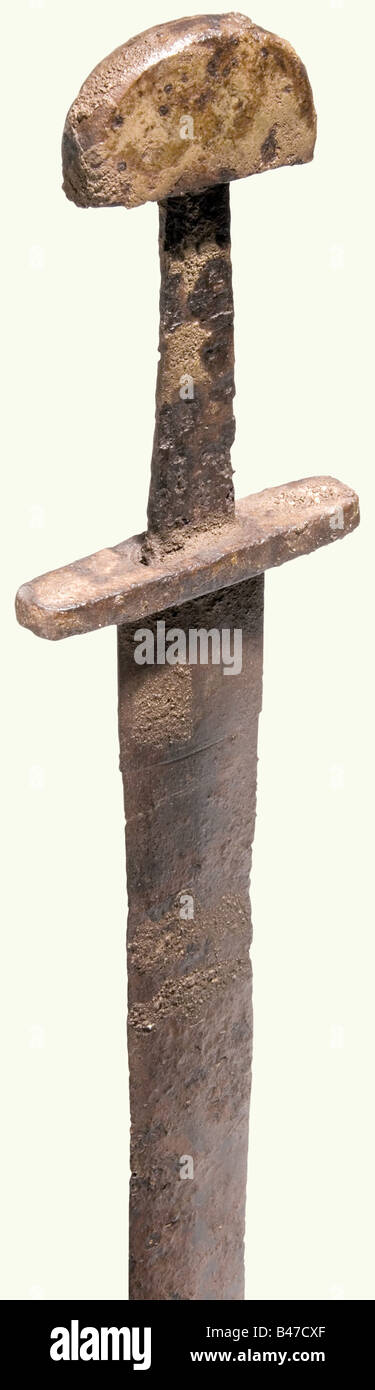 A Central European knightly sword, 10th century. A heavy cutting sword with a lenticular cross section. There is a sheet iron sleeve around the base of the blade. Short, straight quillons with slightly rounded edges. Strong tang with a flattened, half round pommel. Cleaned water discovery with remnants of encrustation. Length 98 cm. Cf. three similar swords found in the south German area in: Alfred Geibig, Beiträge zur morphologischen Entwicklung des Schwertes im Mittelalter, plates 10, 38, and 46. historic, historical, 10th century, sword, swords, weapons, arm, Stock Photo
