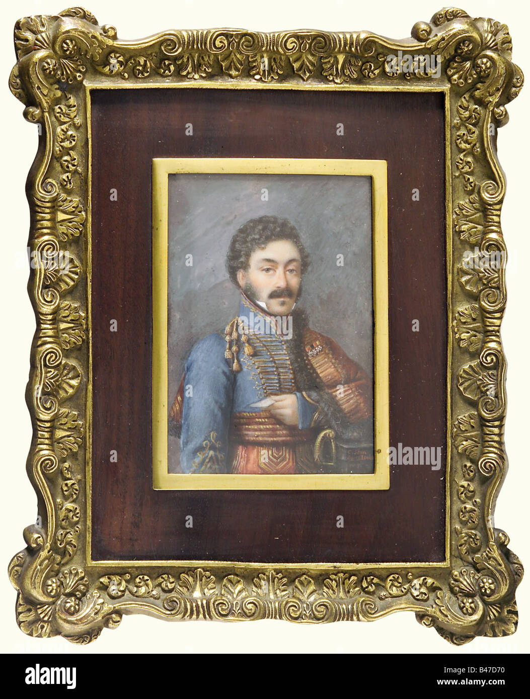 A miniature portrait, of a French hussar officer, 1st Empire. A half-portrait of an officer of the 5th Hussar Regiment with his pelisse hanging from his shoulders, holding a letter in his hand. Very fine painting on ivory, signed bottom right 'C. Jean d'après Isabe(y)'. Picture dimensions 65 x 95 mm. Cast brass frame with wooden passepartout. fine arts, people, 19th century, France, Imperial, French Empire, object, objects, stills, clipping, cut out, cut-out, cut-outs, painting, paintings, fine arts, art, man, men, male, Artist's Copyright has not to be cleared Stock Photo