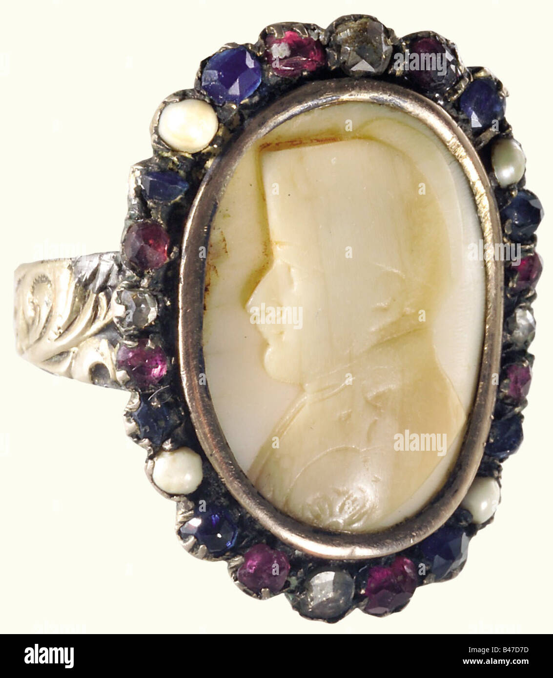Napoleon I, a ring with a carved ivory portrait of the Emperor. A relief carved, ivory cameo with a profile portrait of Napoleon, set in gold, surrounded by a wreath of inset semi-precious stones and river pearls in the French national colours. Several repairs. From the possession of Count Edouard de Monteglas, purchased in 1885. See Hermann Historica, Auction 19, October 1988, Lot 2308, 4,800 DM (2,400 EUR), showing the documentation still available at that time. Presumably the work of the French cameo carver, engraver, and sculptor, Adolph David Baugé 1828 - , Stock Photo