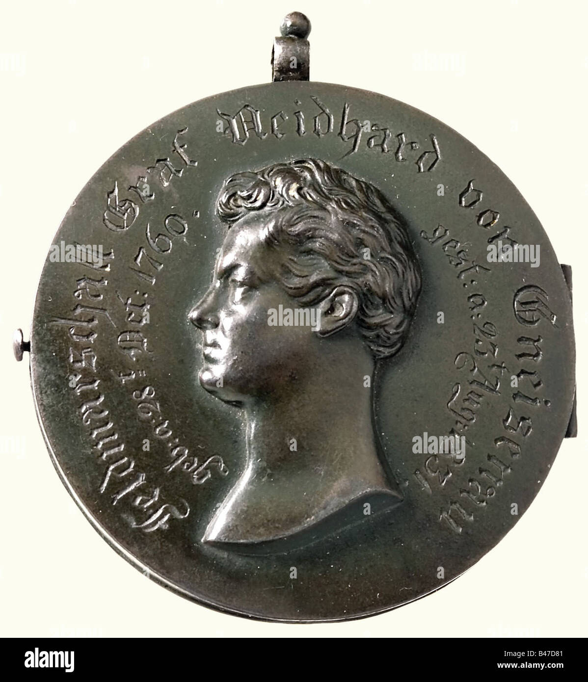 Neidhard von Gneisenau (1760 - 1831), Field Marshal and Army Reformer. Folding iron locket, bearing a relief portrait of Gneisenau's head on the front along with the dates of his birth and death. There is an iron cross in a laurel wreath in relief on the back. Inside is a lock of blond hair, presumably Gneisenau's, sewn on to a piece of light blue silk. The locket has green patina and a suspension ring(?). Diameter 77 mm. Weight 167 grams. people, 19th century, Prussian, Prussia, German, Germany, militaria, military, object, objects, stills, clipping, clippings, Stock Photo