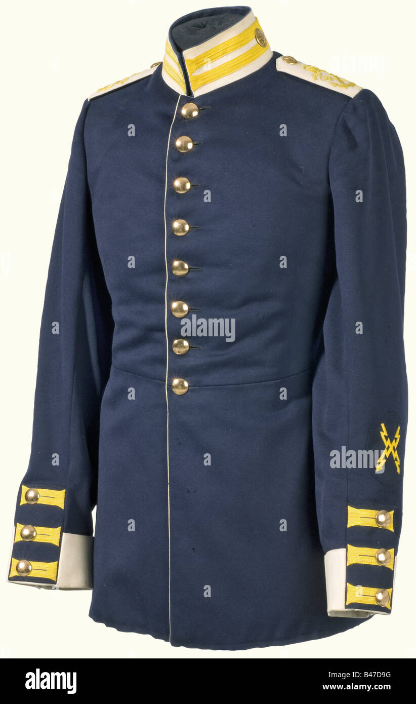 A uniform tunic for a telegrapher private, in the 1st Marine Infantry Battalion. White collar, lapels, and shoulder boards, yellow guard facings and silk embroidery on the epaulettes. There is a telegrapher's insignia on the left sleeve and a 'T' on the epaulette buttons. Private purchase piece in clean condition with bright colours. There area few moth holes on the sleeve and on the coat-tail. Very rare uniform in beautiful condition. historic, historical, 1900s, 1910s, 20th century, navy, naval forces, military, militaria, branch of service, branches of servi, Stock Photo